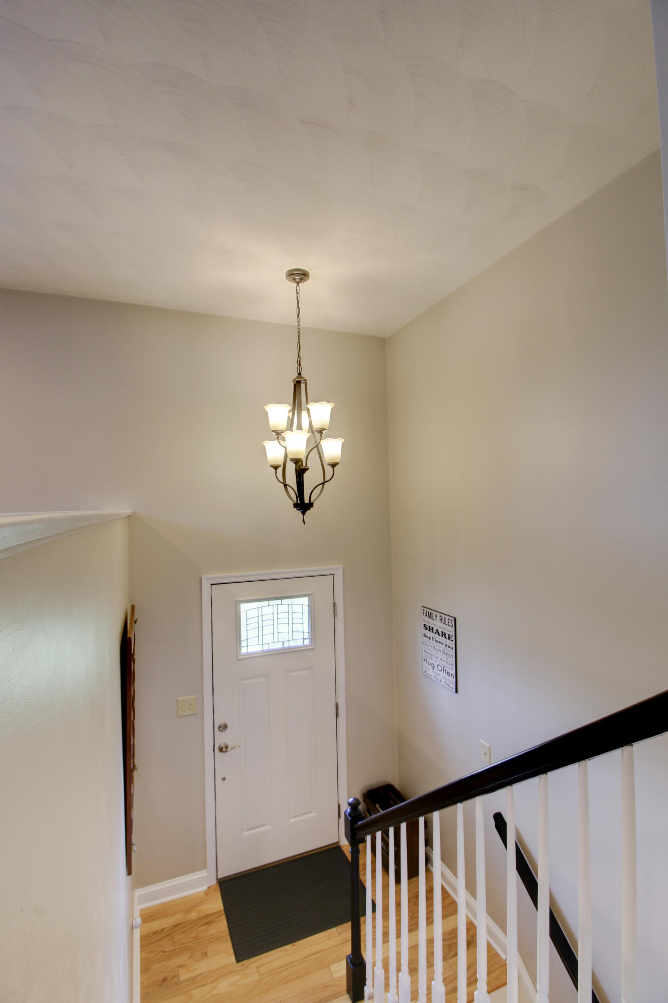 6704 Trevilian Road Roanoke, VA 24019 - Photo 9 of 46 a view of a hallway with a chandelier