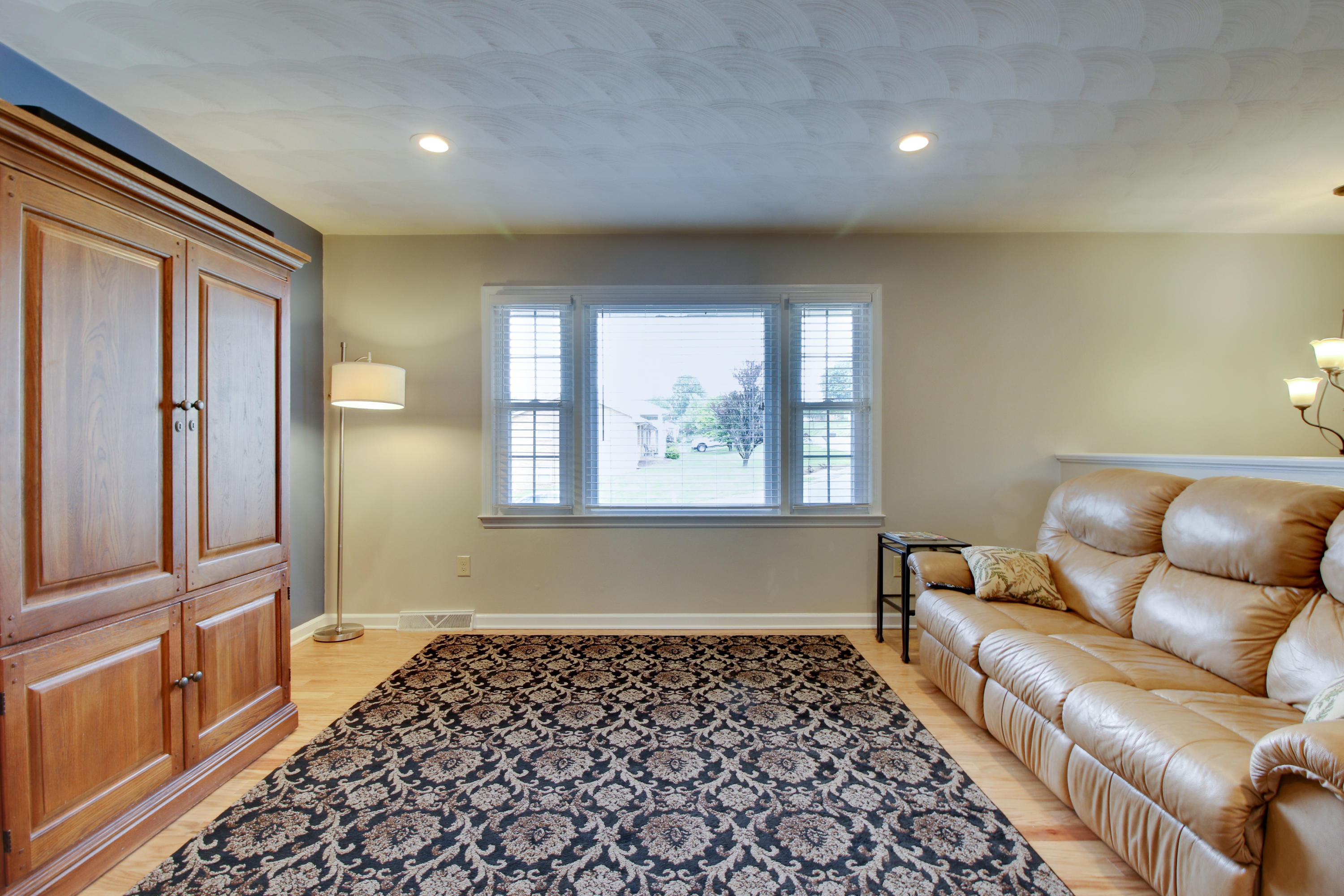 6704 Trevilian Road Roanoke, VA 24019 - Photo 10 of 46 a living room with a black white checkered floor with a large window