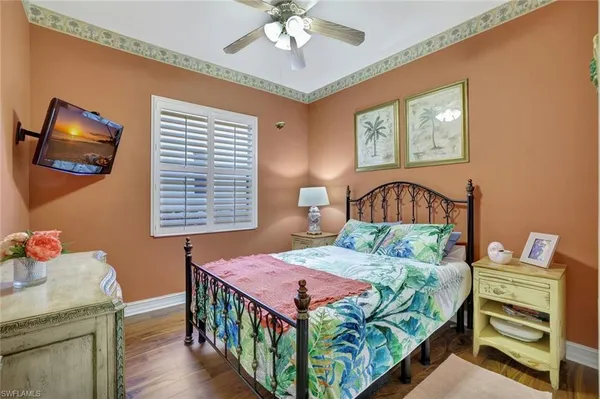 a bedroom that has a bed and a table in it