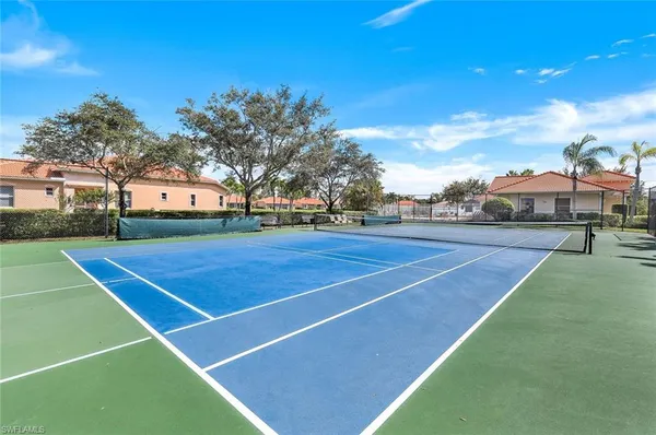 a view of an outdoor space and tennis court