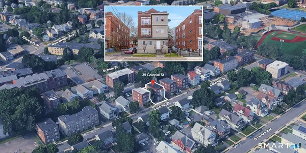 an aerial view of houses with outdoor space