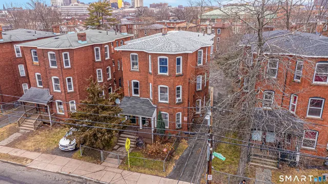 an aerial view of a residential apartment building with a yard