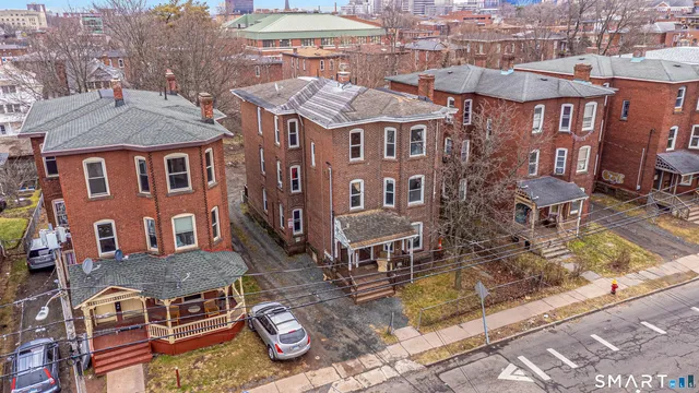 a aerial view of a brick building with many windows