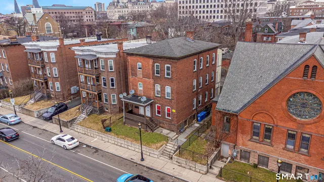 a view of a brick building with many windows