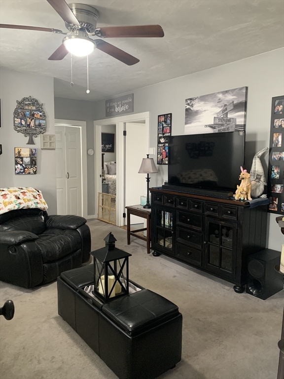 149 Smith Street Fall River, MA 02721 - Photo 11 of 38 a living room with furniture and a flat screen tv