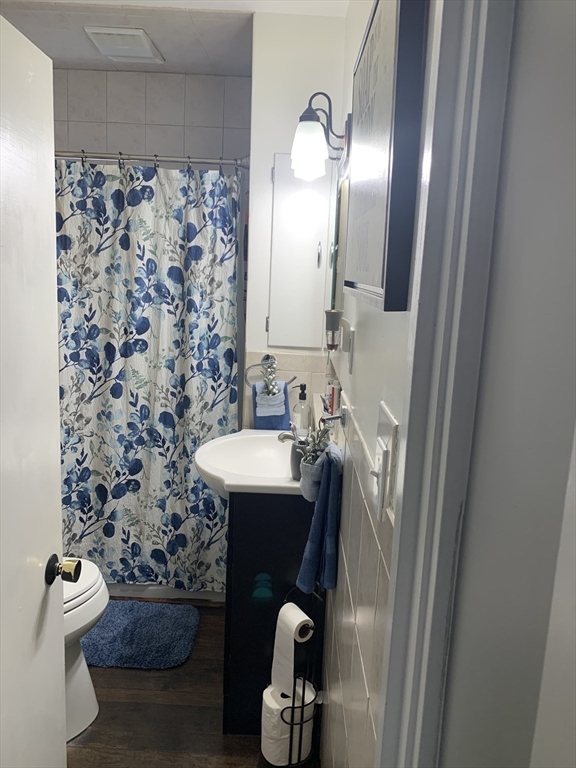 149 Smith Street Fall River, MA 02721 - Photo 12 of 38 a bathroom with a sink and a mirror
