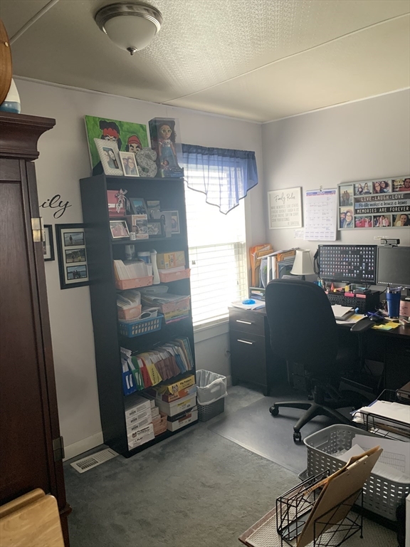 149 Smith Street Fall River, MA 02721 - Photo 16 of 38 a room with furniture and a window