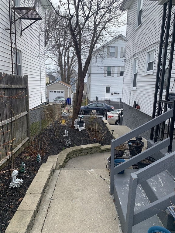 149 Smith Street Fall River, MA 02721 - Photo 2 of 38 a view of backyard with deck and seating area
