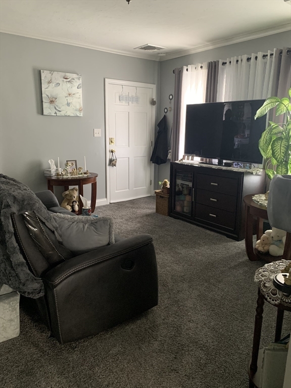 149 Smith Street Fall River, MA 02721 - Photo 25 of 38 a living room with furniture and a flat screen tv