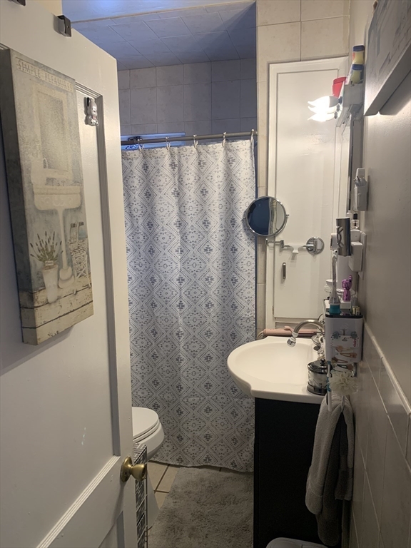 149 Smith Street Fall River, MA 02721 - Photo 27 of 38 a bathroom with a sink and mirror