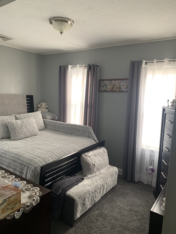 149 Smith Street Fall River, MA 02721 - Photo 28 of 38 a bedroom with a bed and a window