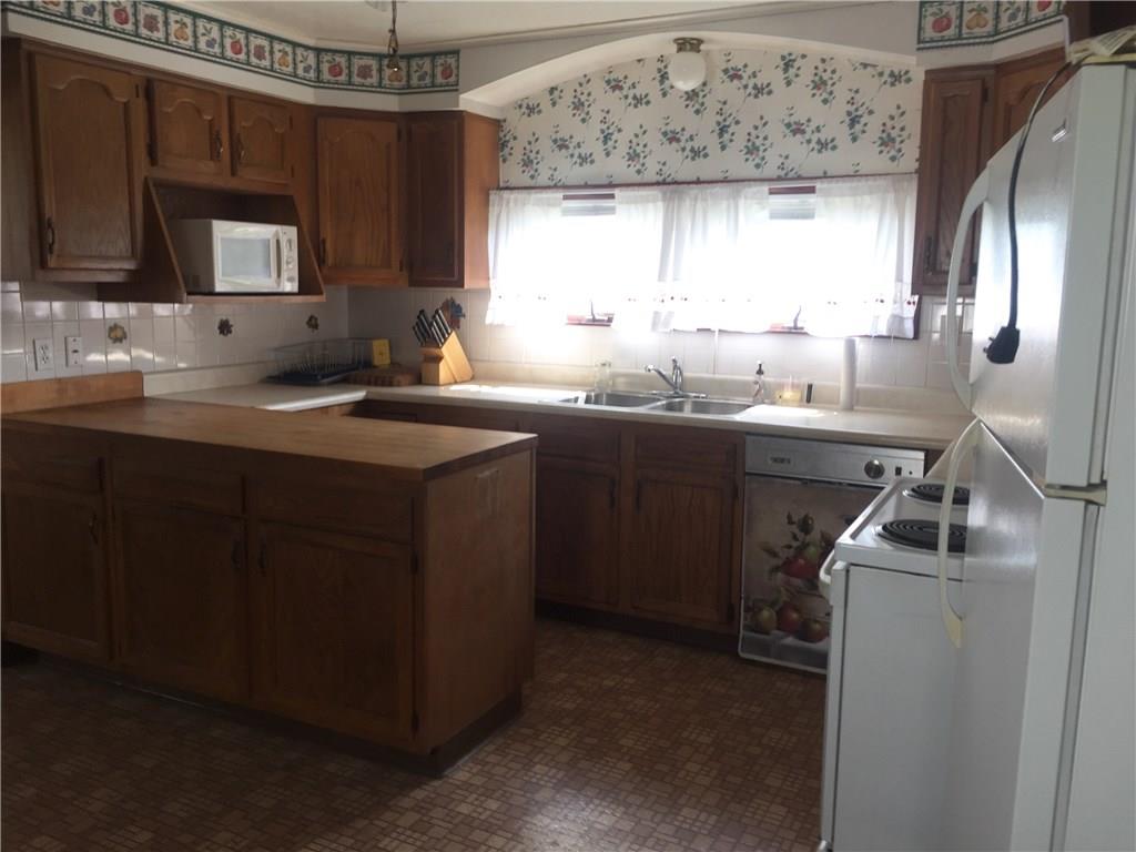 401 Lowber Road Lowber, PA 15660 - Photo 3 of 15 equipped kitchen, oak cabinets. dishwasher as is condition