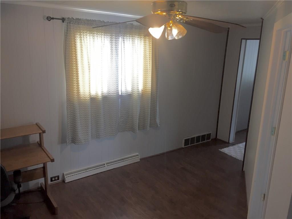 401 Lowber Road Lowber, PA 15660 - Photo 5 of 15 hallway with updated wood laminate flooring