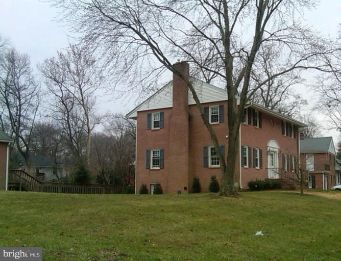 8413 Riverside Road Alexandria, VA 22308 - Photo 1 of 28 a front view of a house with a garden