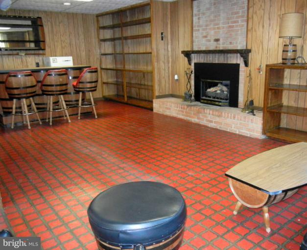 8413 Riverside Road Alexandria, VA 22308 - Photo 12 of 28 a room with furniture and a fireplace