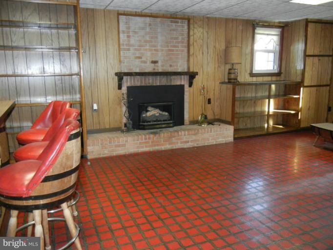 8413 Riverside Road Alexandria, VA 22308 - Photo 24 of 28 a view of a livingroom with furniture and a fireplace