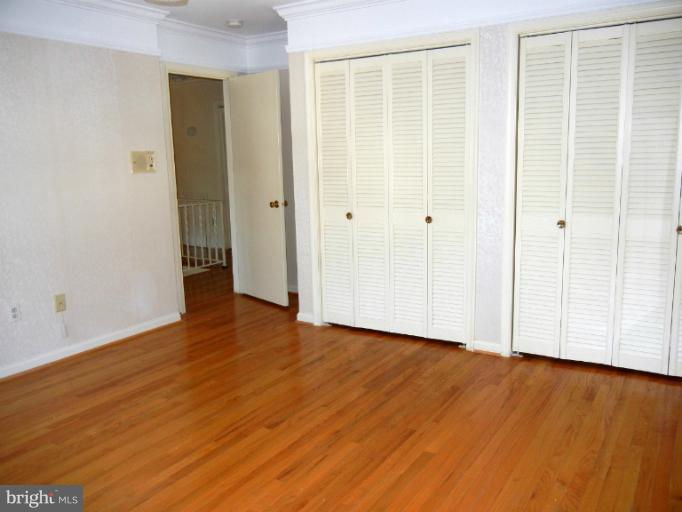 8413 Riverside Road Alexandria, VA 22308 - Photo 27 of 28 a view of an empty room with wooden floor and a window