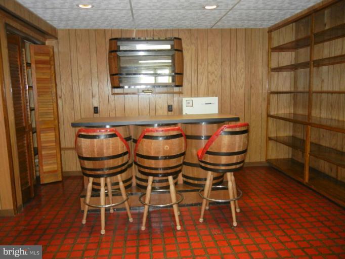 8413 Riverside Road Alexandria, VA 22308 - Photo 28 of 28 a dining room with wooden floor and a window