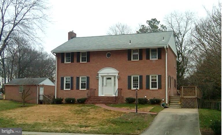 8413 Riverside Road Alexandria, VA 22308 - Photo 4 of 28 front view of a house with a yard