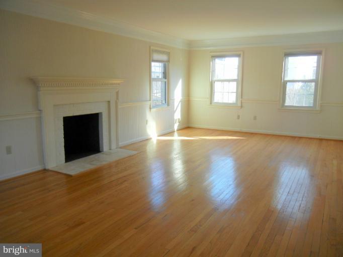 8413 Riverside Road Alexandria, VA 22308 - Photo 9 of 28 a view of an empty room with wooden floor and a window