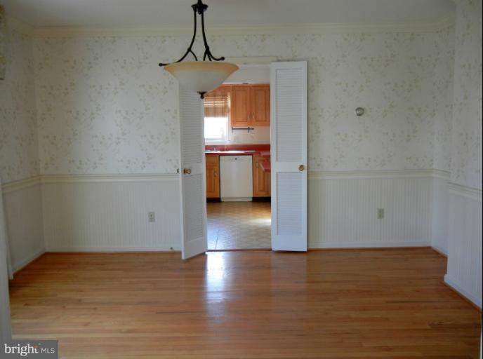 8413 Riverside Road Alexandria, VA 22308 - Photo 10 of 28 a view of a kitchen with a sink and a stove top oven