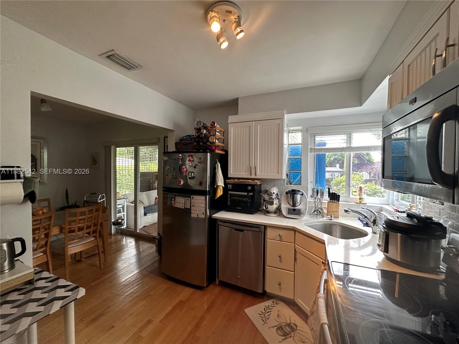 2270 Southwest 24th Street Miami, FL 33145 - Photo 11 of 35 a kitchen with a sink appliances and cabinets