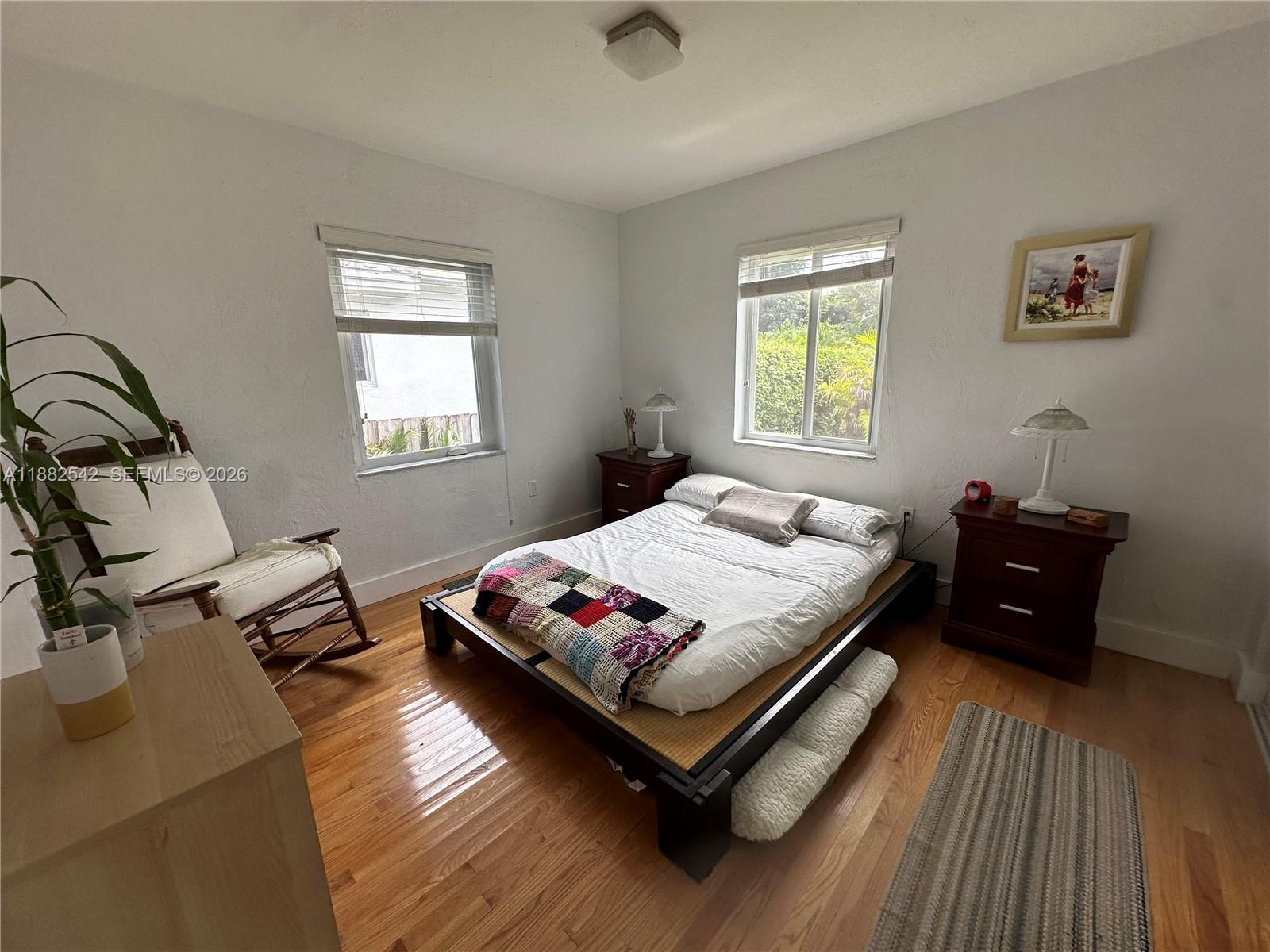 2270 Southwest 24th Street Miami, FL 33145 - Photo 12 of 35 a bed sitting in a bedroom next to a window