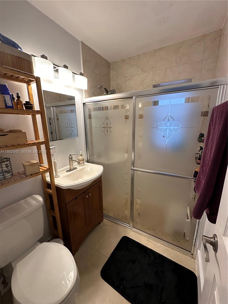 2270 Southwest 24th Street Miami, FL 33145 - Photo 14 of 35 a bathroom with a sink toilet and shower