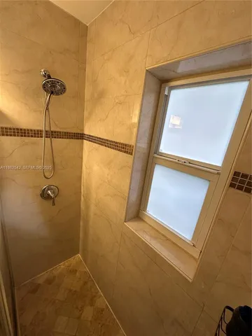 a living room with furniture gym equipment and a flat screen tv