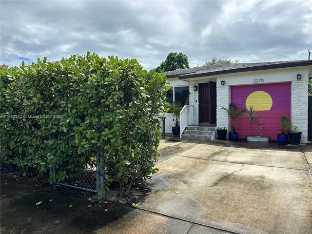 a front view of a house with yard