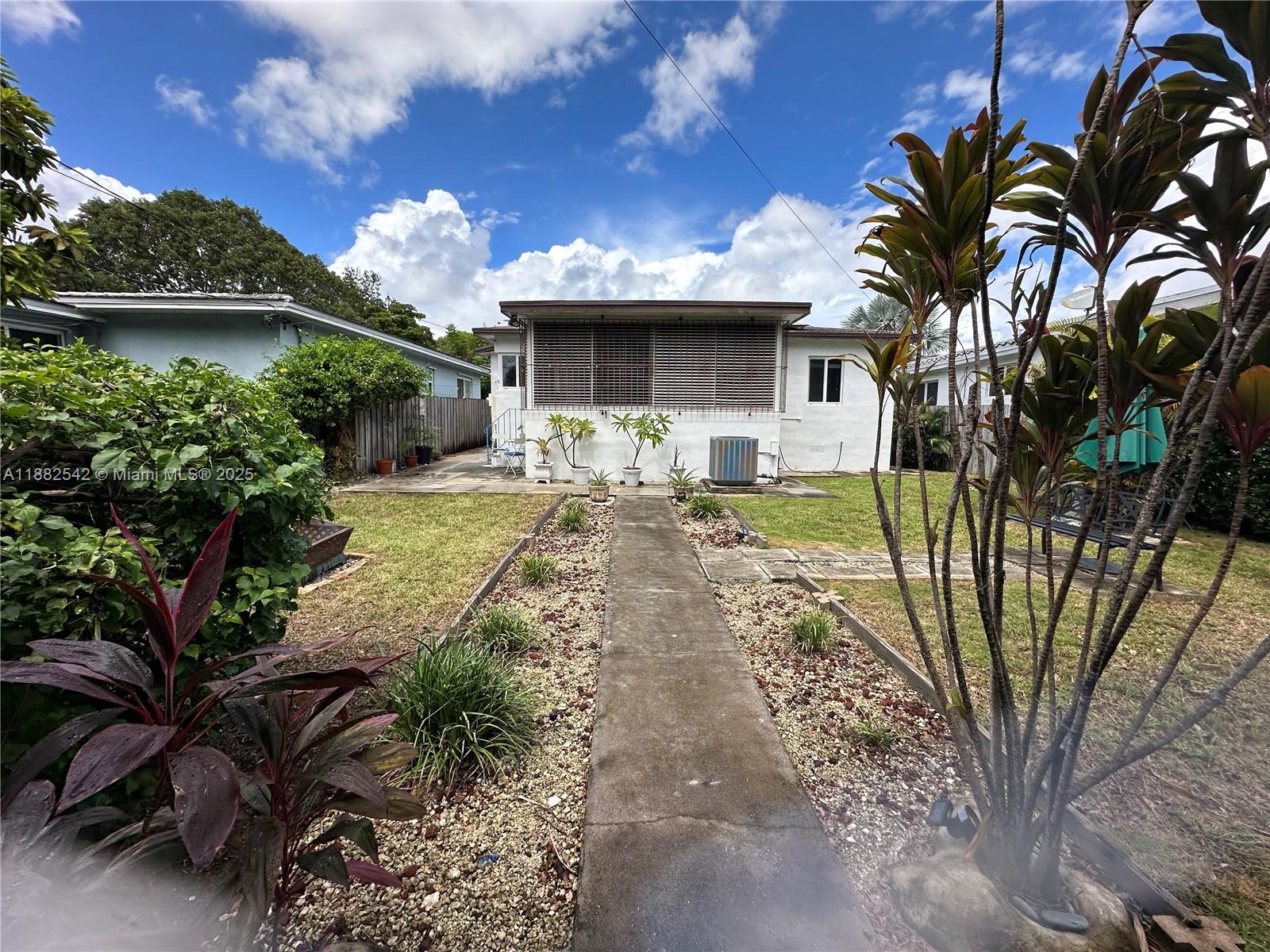 2270 Southwest 24th Street Miami, FL 33145 - Photo 22 of 28 a front view of a house with garden