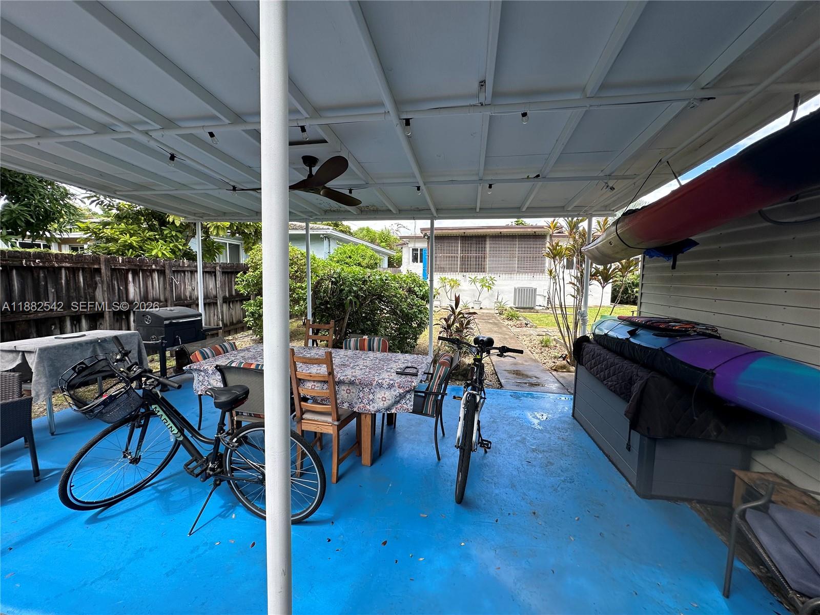 2270 Southwest 24th Street Miami, FL 33145 - Photo 24 of 35 a living room with patio furniture and a wooden floor
