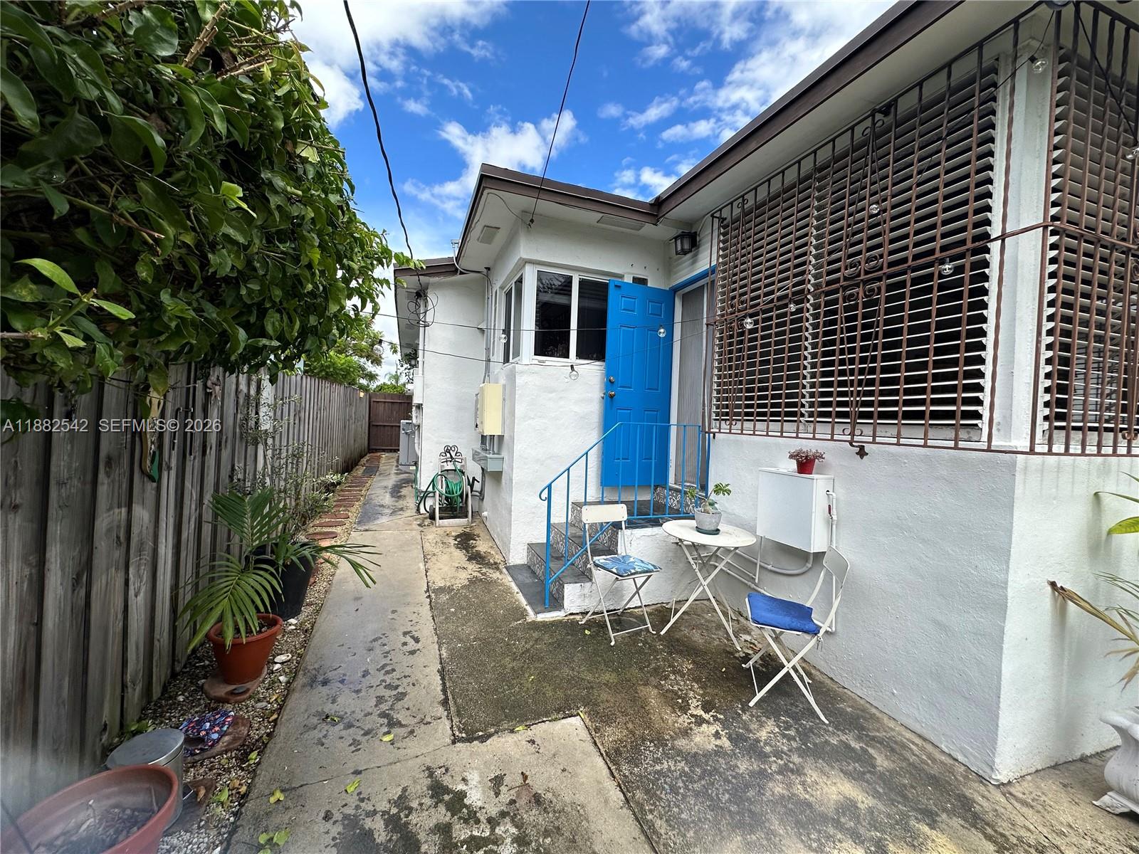 2270 Southwest 24th Street Miami, FL 33145 - Photo 25 of 35 a view of a house with backyard and sitting area
