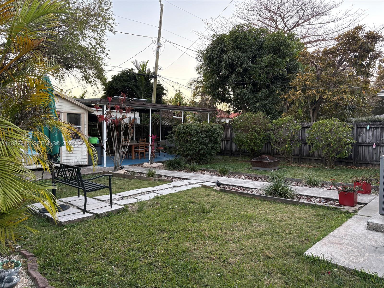 2270 Southwest 24th Street Miami, FL 33145 - Photo 31 of 35 a view of a house with backyard and a slide