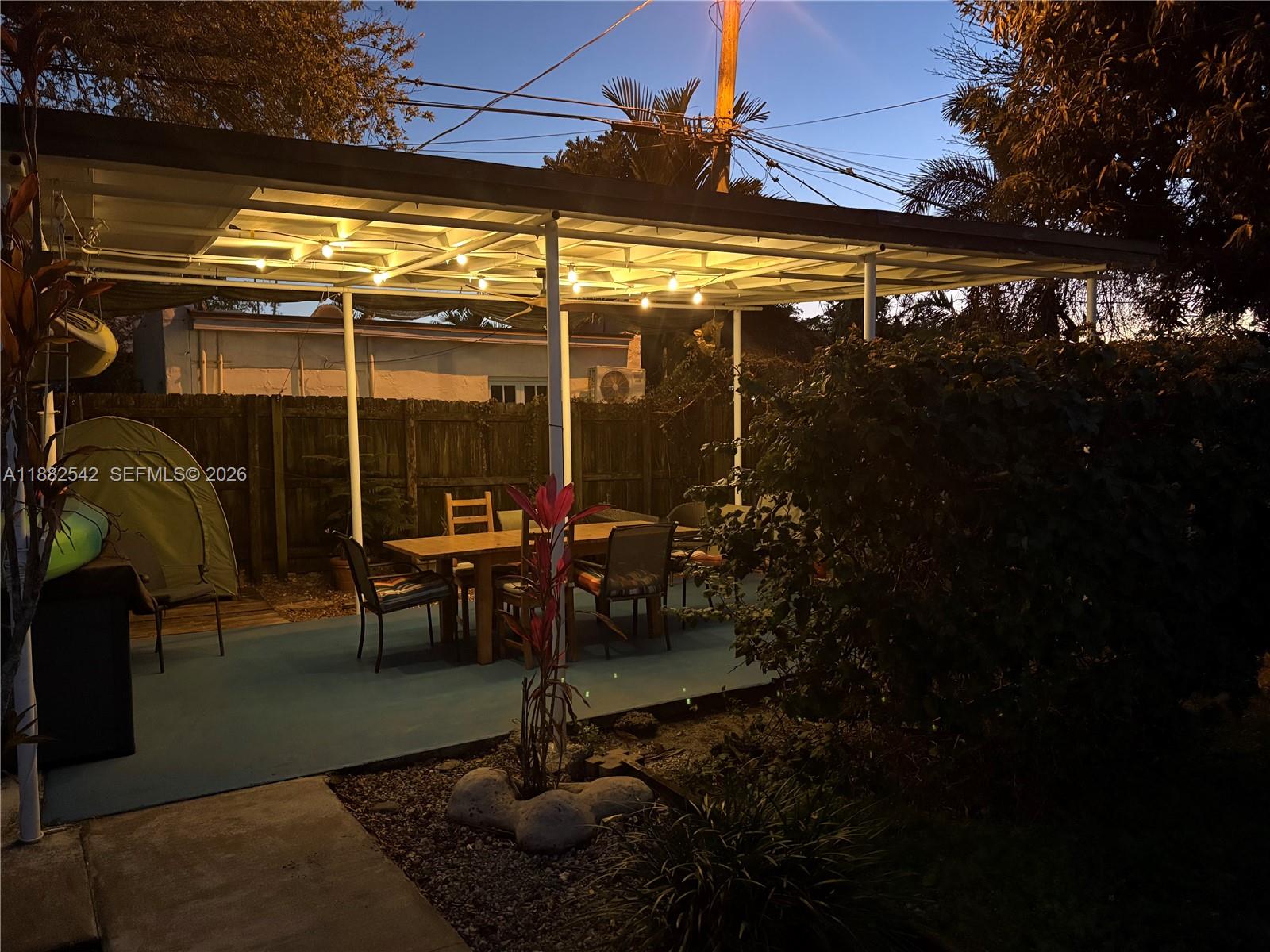 2270 Southwest 24th Street Miami, FL 33145 - Photo 34 of 35 a view of a patio with table and chairs potted plants