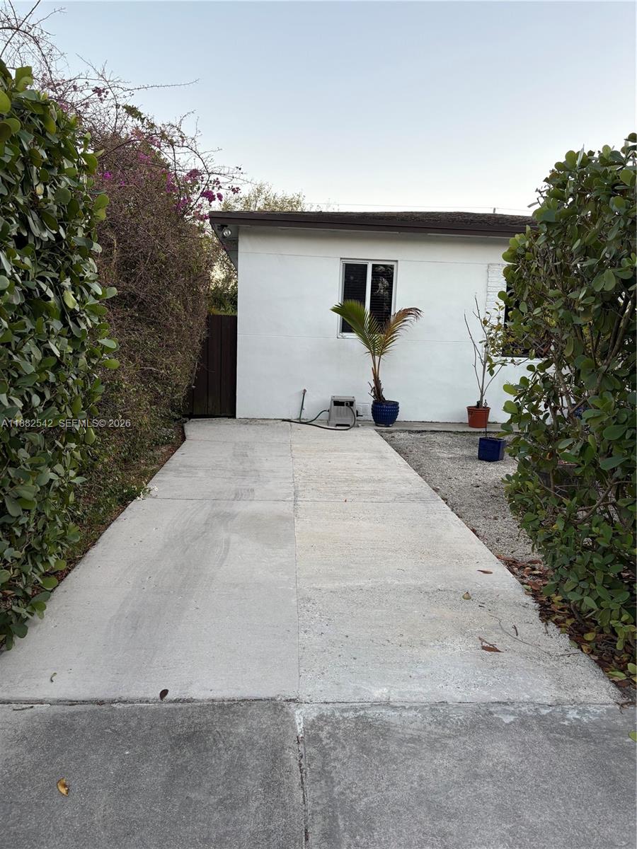 2270 Southwest 24th Street Miami, FL 33145 - Photo 4 of 35 a backyard of a house with plants and trees