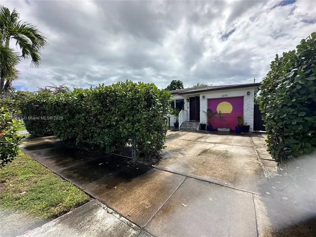 a house view with a garden space
