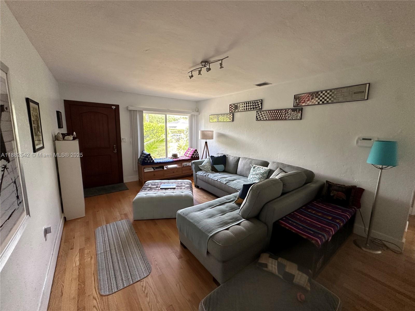 2270 Southwest 24th Street Miami, FL 33145 - Photo 6 of 28 a living room with furniture and a rug