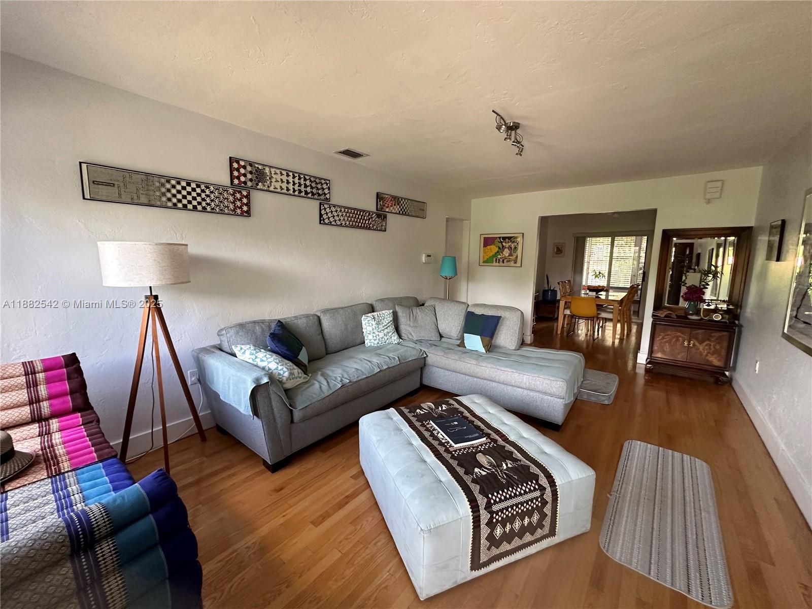 2270 Southwest 24th Street Miami, FL 33145 - Photo 7 of 28 a living room with furniture or couch and a wooden floor