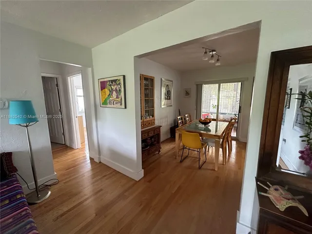 a view of a livingroom with furniture and a flat screen tv