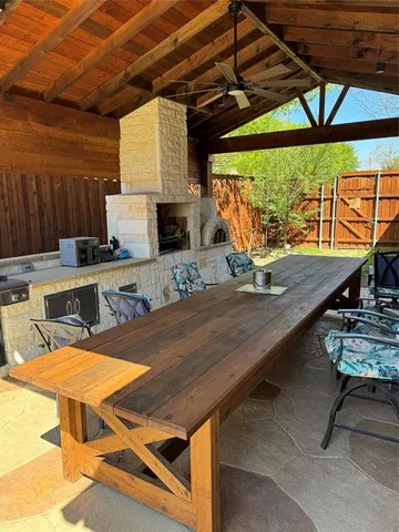 a dining room with a table and chairs
