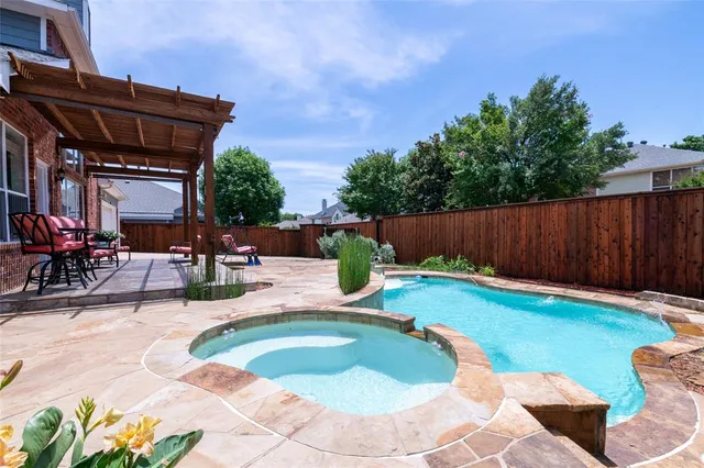 a view of swimming pool with outdoor seating