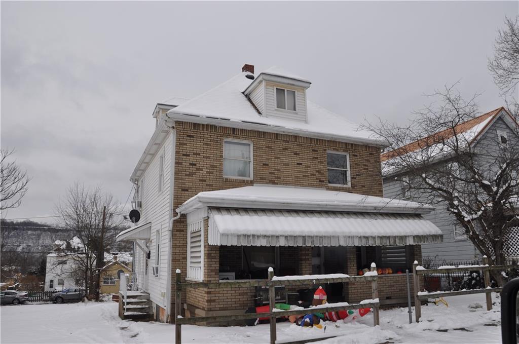 a front view of a building with parking
