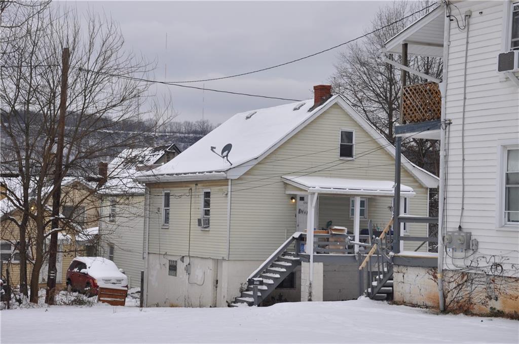 1213 Kenneth Natrona Heights, PA 15065 - Photo 2 of 2 a front view of a house with garage