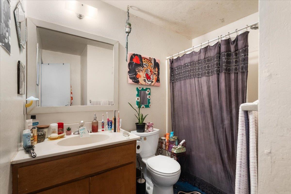 10985 Tyler Foote Road Nevada City, CA 95959 - Photo 14 of 27 a bathroom with a sink vanity mirror and toilet
