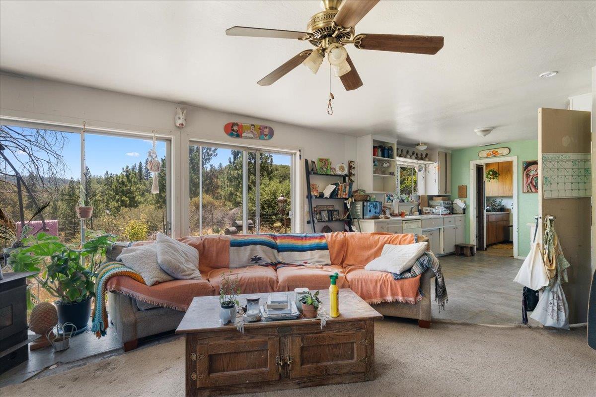 10985 Tyler Foote Road Nevada City, CA 95959 - Photo 9 of 27 a living room with furniture and a large window