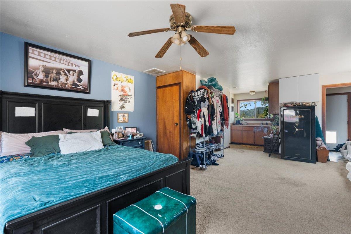 10985 Tyler Foote Road Nevada City, CA 95959 - Photo 10 of 27 a living room with fireplace furniture and a flat screen tv