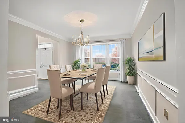 a view of a dining room with furniture and window