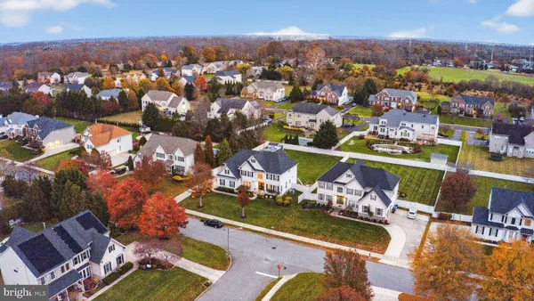 an aerial view of a house with a ocean view