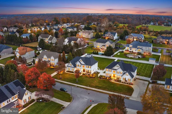 an aerial view of a house with a ocean view